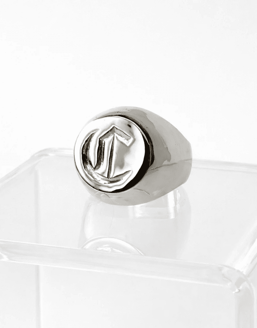 Silver signet ring with a hand-cut monogram